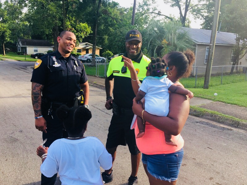 A TPD Officer interacts with members of the community