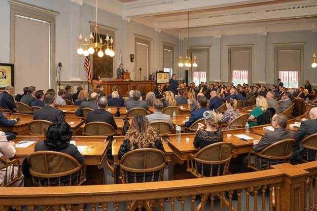 A long shot of people in suits at the Capitol. Photo by Meredith Geddings and Sarah Gray of Florida House Photography