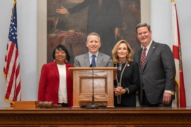 Mayor John Dailey joins leaders at the podium. Photo by Meredith Geddings and Sarah Gray of Florida House Photography